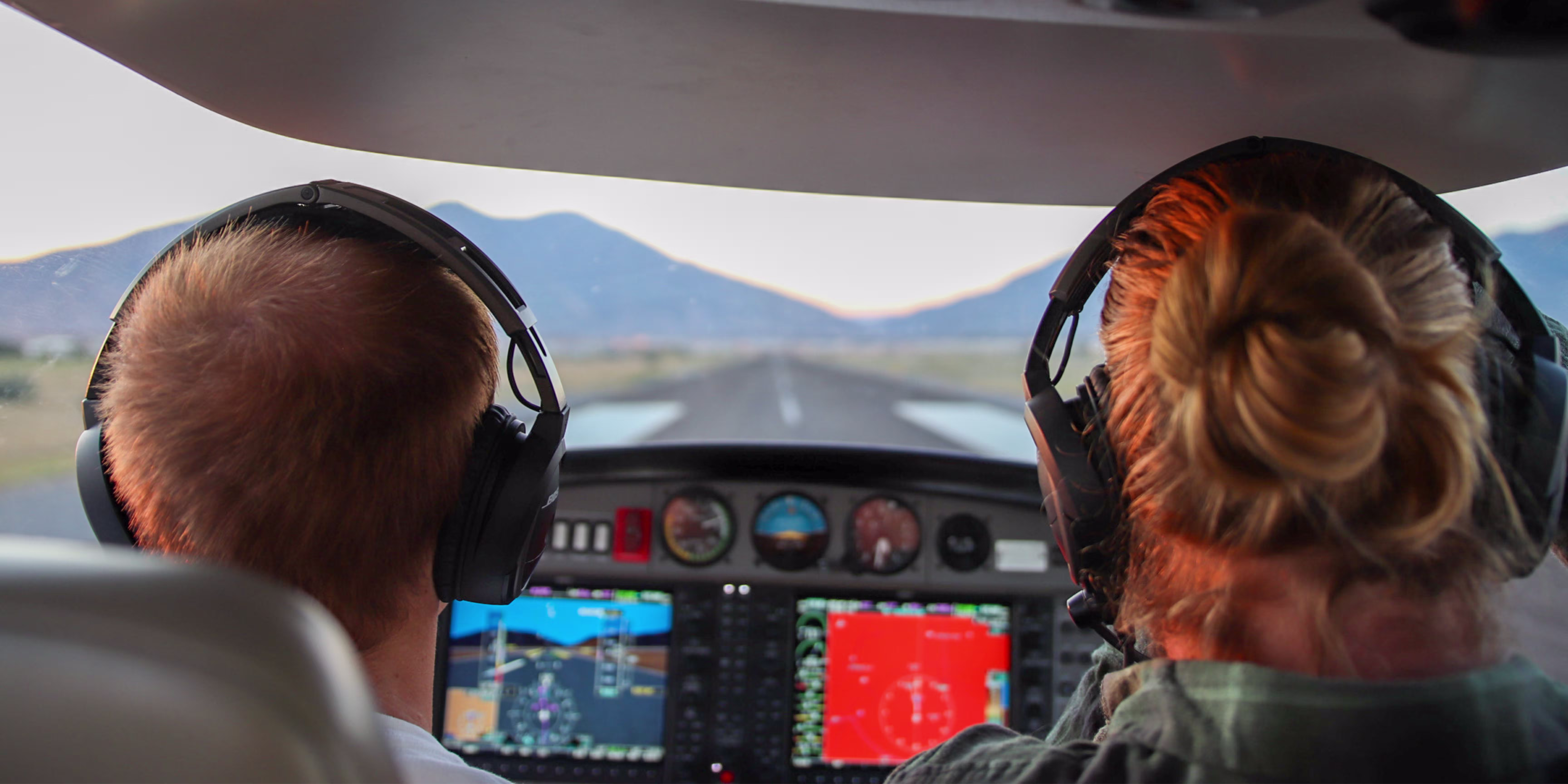 Pilot in the cockpit of a Diamond DA40 flying over Utah Valley with Garmin G1000 glass cockpit